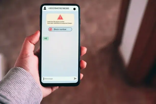 Woman receives message from suspected number scam.