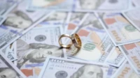 golden-wedding-rings-money-background_368093-9891 (1)